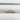 14K Y gold diamond band with single baguette bezel dia